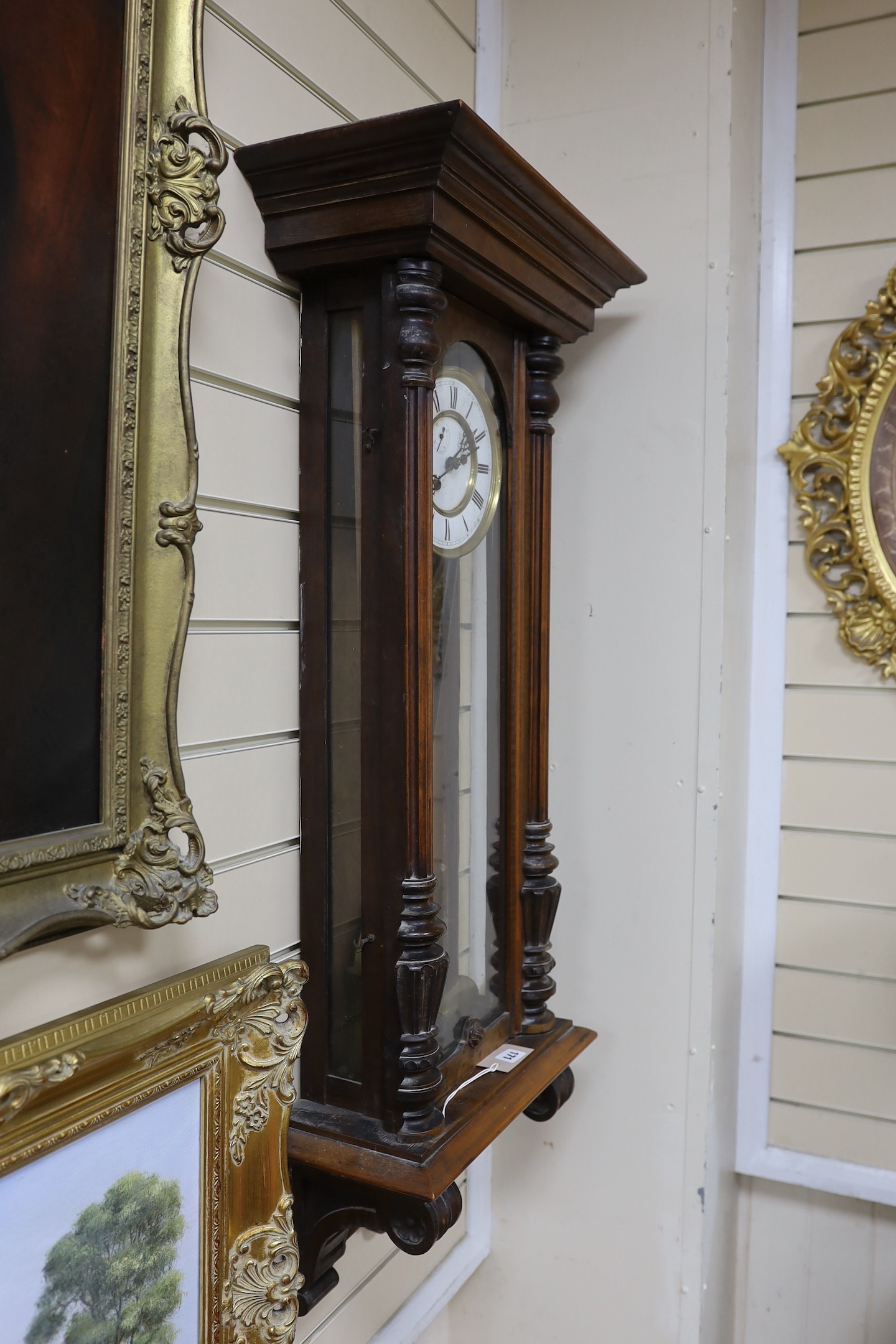 An early 20th century Vienna type wall clock